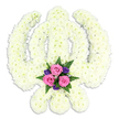 An exquisitely shaped Sikh Khanda floral tribute stands out clearly against a stark white backdrop, its form defined by a meticulously arranged sea of white petals. The central double-edged sword is upright and steady, encased by the circular line of the chakkar, while two sweeping kirpans on either side curve gracefully and cross at the base. Every contour is filled with small white chrysanthemums, packed so densely that the surface looks gently padded, as if one could press a hand against it and feel the spring of countless fresh blooms. The uniform cream-white colour conveys an immediate sense of innocence, peace, and spiritual focus, much like the hushed atmosphere when mourners gather at a Sikh funeral service in Archway. At the very bottom of the symbol, resting between the lower blades, a neat accent arrangement of coloured flowers provides a warm, human touch. Three open pink roses form the centre, their soft petals layered in delicate curls, accompanied by smaller deep purple flowers and light, feathery fern foliage in rich green. This combination of pink, purple, and green stands out gently, guiding the eye downward to a point of emotional connection within the more formal white design. The lighting is even, with a slight shadow beneath the tribute suggesting it is raised on an easel, ready to take its place by a coffin or memorial photograph. The overall impression is of a thoughtful, culturally aware floral piece, likely created by Archway Flowers for Sikh families in the area, offering a visually powerful expression of sympathy, reverence, and enduring faith.